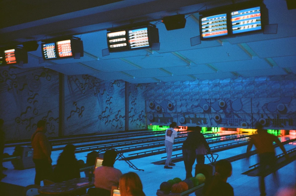 Adults playing bowling in a recreational league