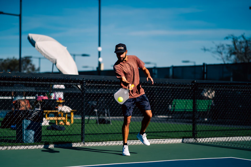 Adults playing pickleball in a recreational league
