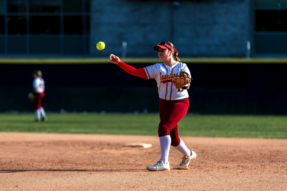 Adults playing softball in a recreational league